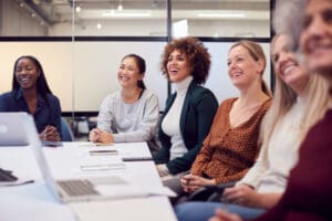 Women together at a table working