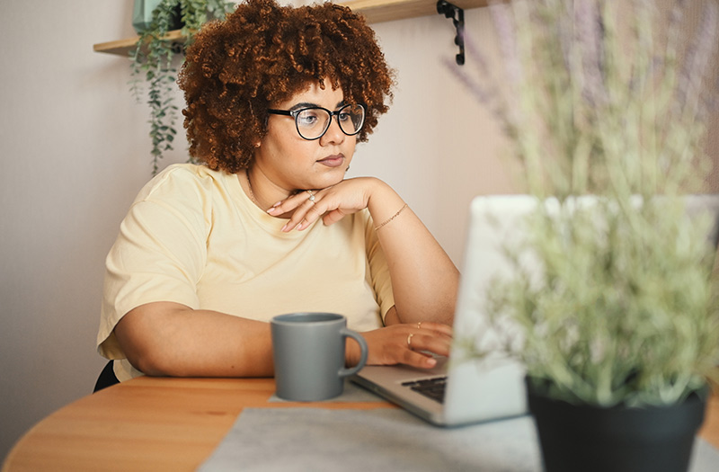 Individual working on laptop