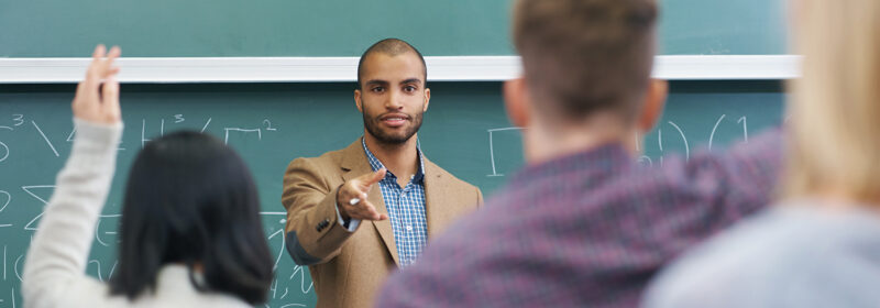 Man standing in front of a classroom