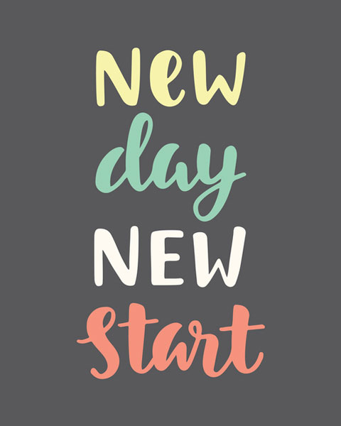black background with the writing new day new start in yellow, green, white, and red- one color for each word.